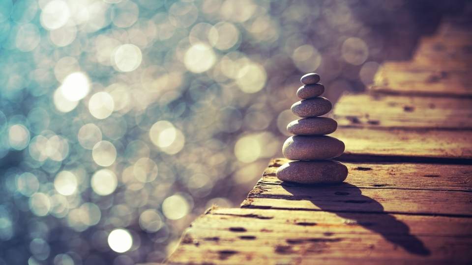 urge surfing represented by a calm stack of stones.
