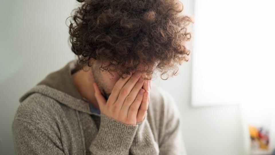Is valium addictive yes, a man looks down as he experiences cravings for valium.