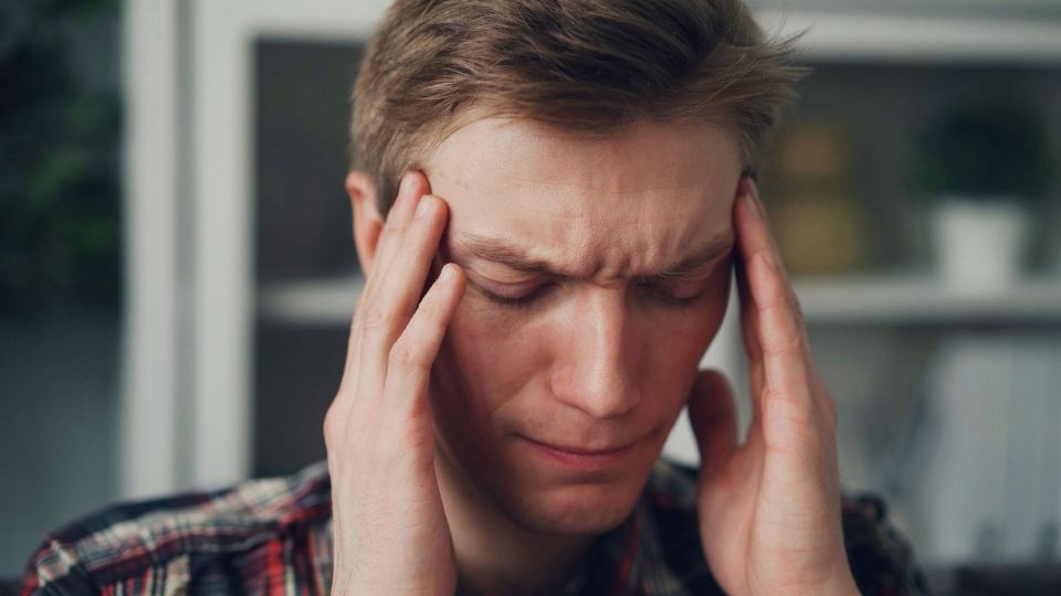 Ativan Withdrawal Symptoms A Complete Timeline hero image of a man with a headache.